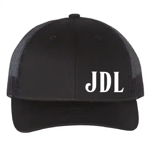 Black trucker hat with JDL logo in white, casual accessory for everyday wear.